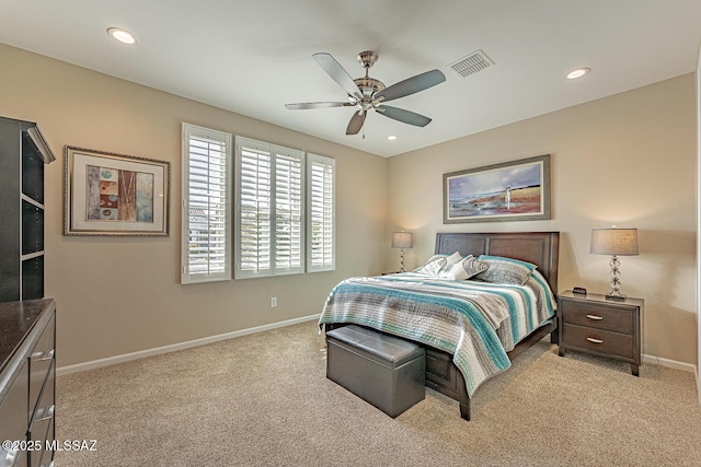 bedroom featuring light colored carpet and ceiling fan