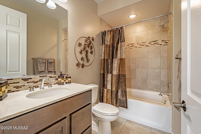 full bathroom featuring tasteful backsplash, tile patterned flooring, toilet, shower / tub combo with curtain, and vanity