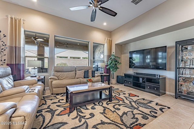 living room with ceiling fan and light tile patterned floors