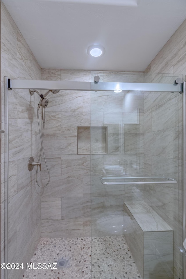 bathroom featuring a shower stall