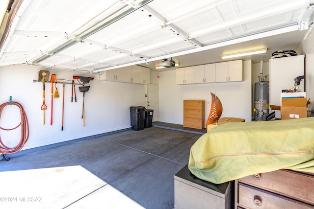 garage with a garage door opener and water heater