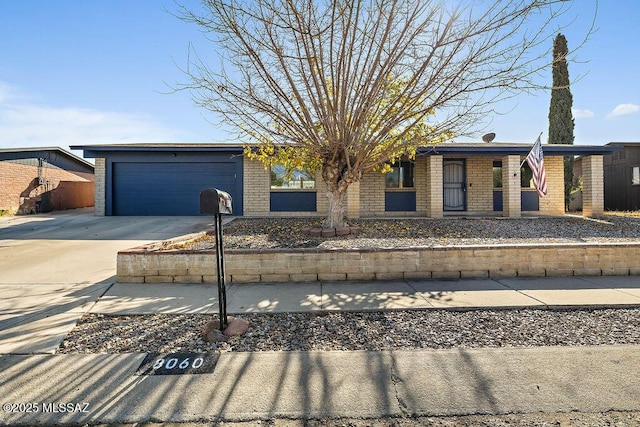 single story home with a garage