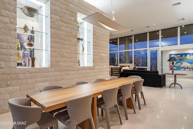 dining space featuring a high ceiling