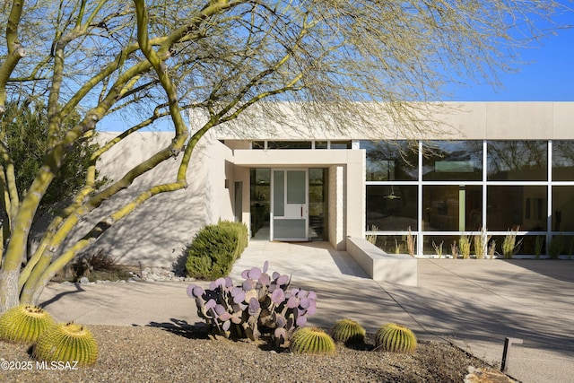 rear view of property featuring a patio