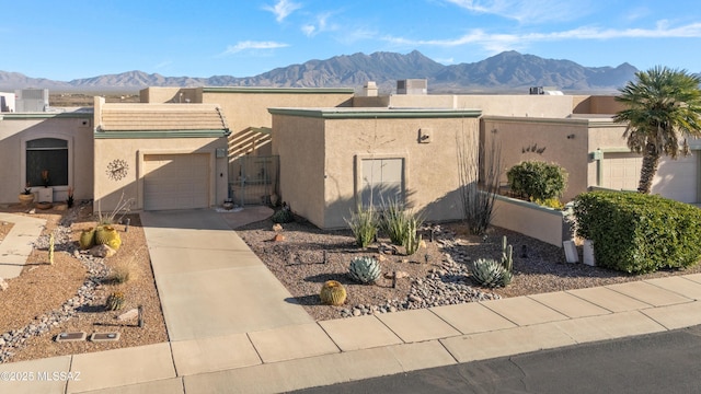 view of front of house featuring a garage and a mountain view