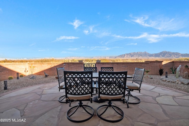 view of patio / terrace with a mountain view