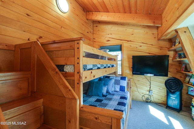 bedroom featuring carpet flooring, wood ceiling, and wooden walls