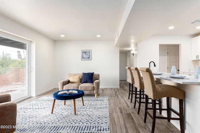 living room with light hardwood / wood-style flooring