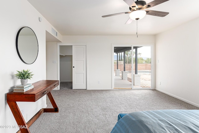 unfurnished bedroom featuring ceiling fan, access to exterior, and carpet