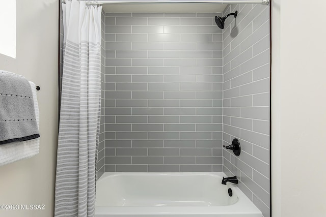 bathroom featuring shower / bathtub combination with curtain