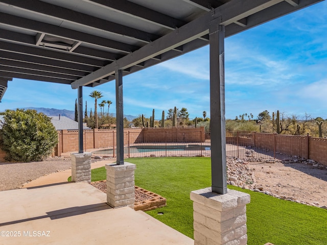 view of yard with a pool and a patio area