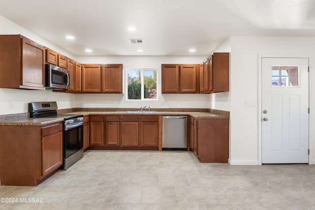 kitchen featuring appliances with stainless steel finishes and sink