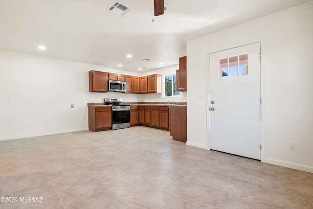 kitchen featuring sink, ceiling fan, and appliances with stainless steel finishes