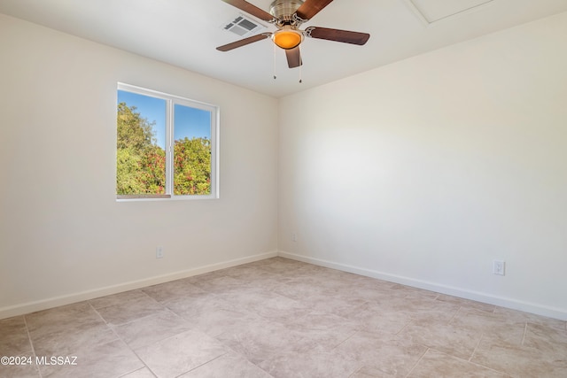 spare room with ceiling fan