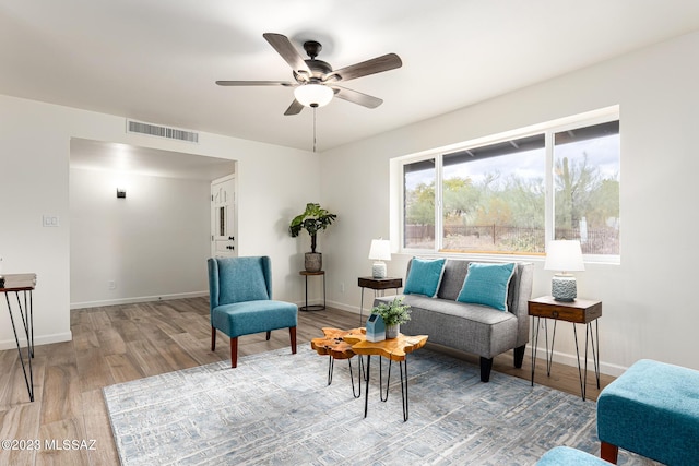 sitting room featuring hardwood / wood-style flooring and ceiling fan