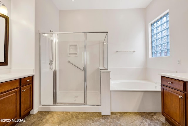 bathroom with vanity and plus walk in shower