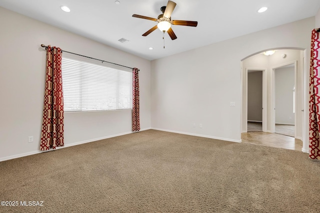 spare room featuring ceiling fan and carpet flooring