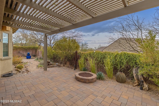 view of patio with a fire pit and a pergola