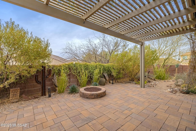 view of patio / terrace featuring an outdoor fire pit and a pergola