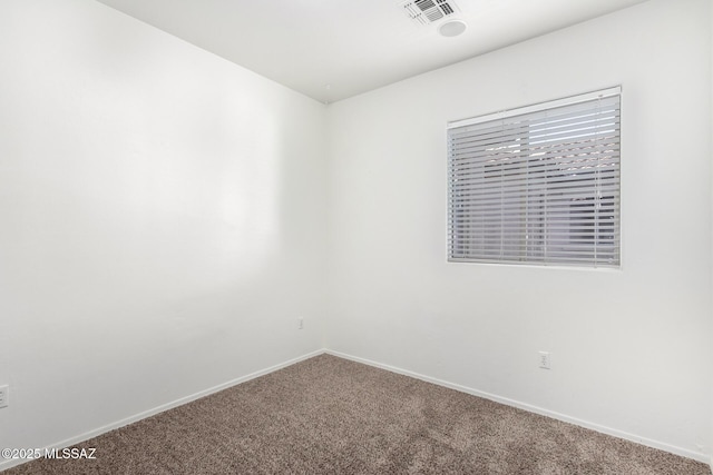 spare room with carpet flooring