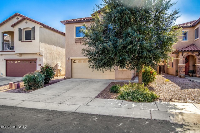 mediterranean / spanish-style home with a garage