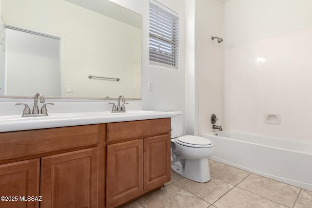 full bathroom featuring vanity, tile patterned flooring, toilet, and washtub / shower combination