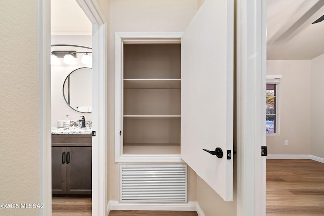 pantry featuring visible vents and a sink