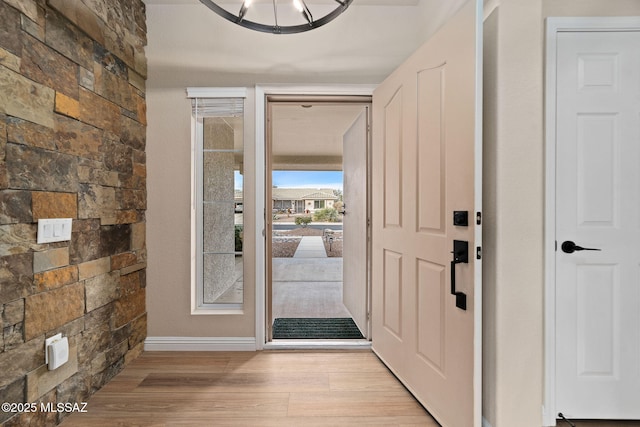 foyer entrance with light wood finished floors