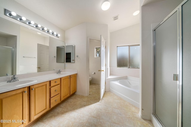 full bathroom with lofted ceiling, vanity, toilet, and independent shower and bath