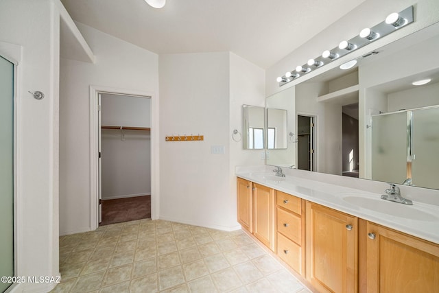 bathroom with vanity and an enclosed shower