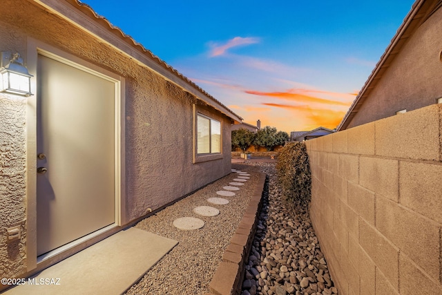 view of property exterior at dusk