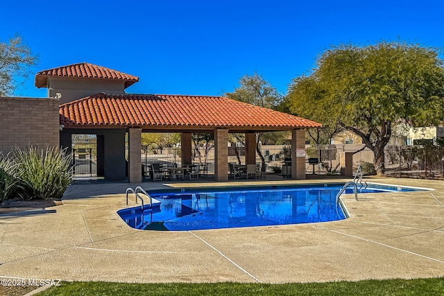 view of pool with a patio and a gazebo