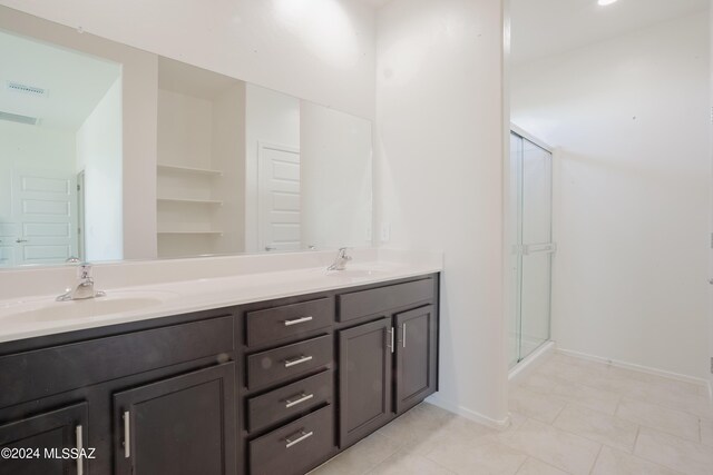 bathroom featuring vanity and tile patterned flooring