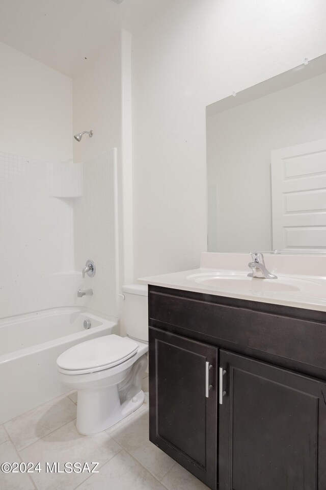 laundry area featuring light tile patterned flooring and washer and clothes dryer