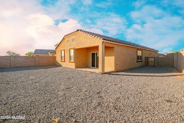 back of house featuring a patio area