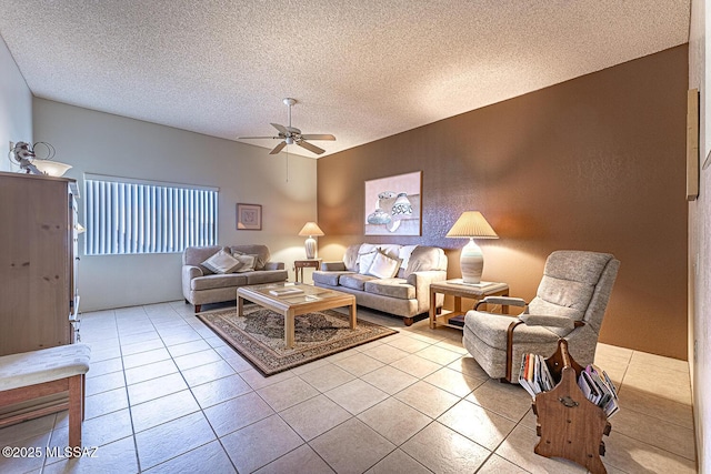 tiled living room featuring a textured ceiling and ceiling fan