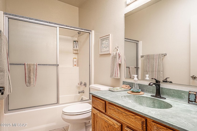 full bathroom with toilet, vanity, and enclosed tub / shower combo