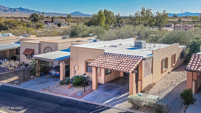 birds eye view of property featuring a mountain view