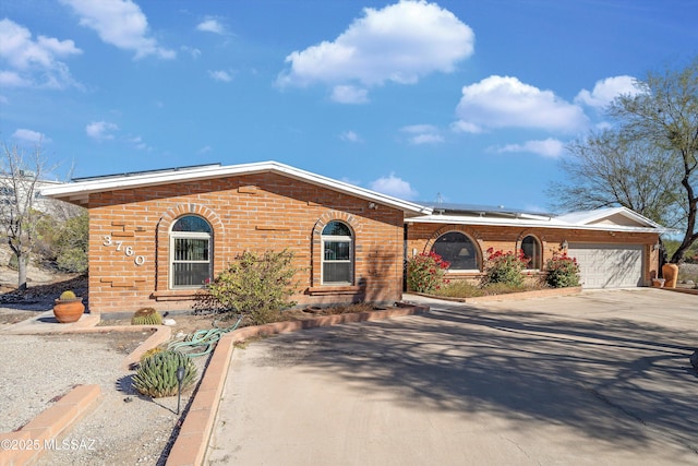 single story home featuring a garage