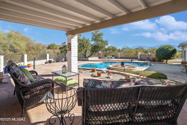 view of swimming pool with an outdoor living space and a patio area