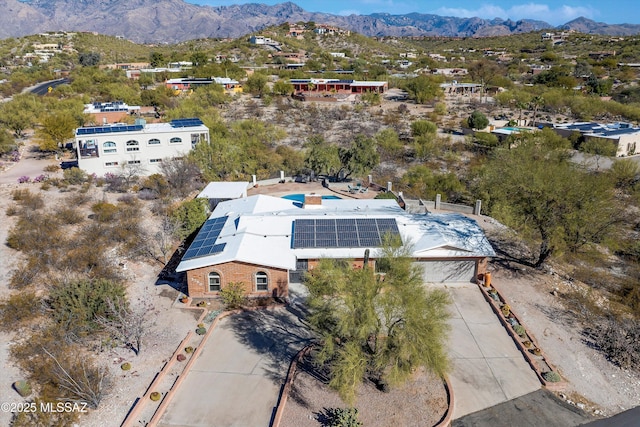 birds eye view of property with a mountain view