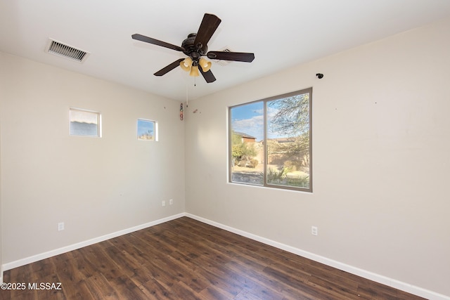 unfurnished room with ceiling fan and dark hardwood / wood-style floors