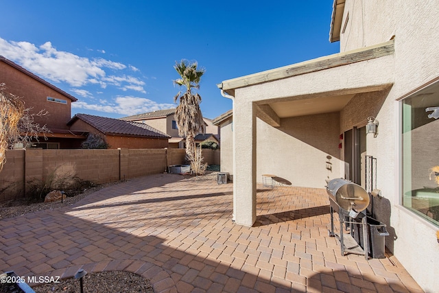 view of patio featuring a grill