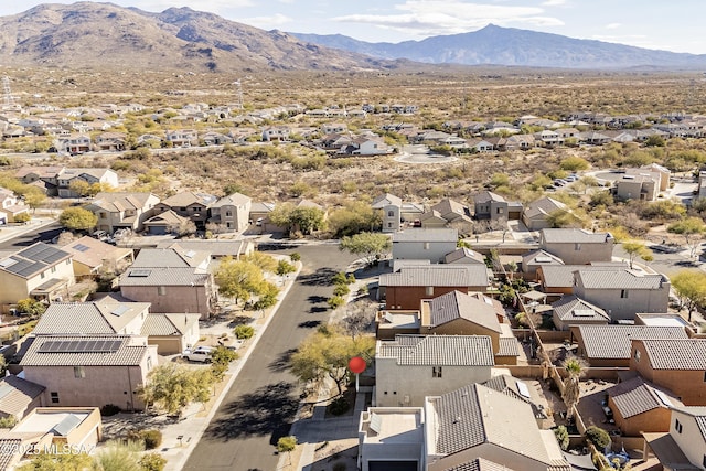 birds eye view of property with a mountain view and a residential view