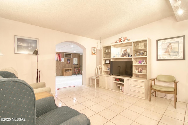 tiled living room with a textured ceiling