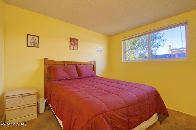 carpeted bedroom with a textured ceiling