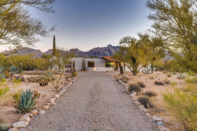 view of front of home featuring a mountain view