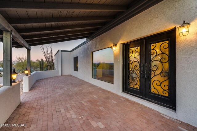 view of patio terrace at dusk