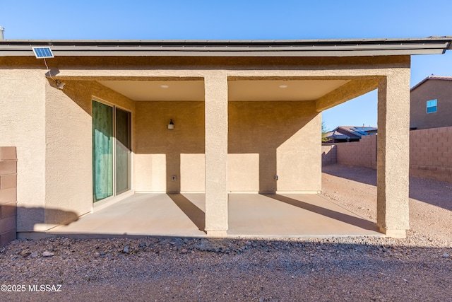 property entrance with a patio