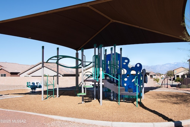 view of playground featuring a mountain view